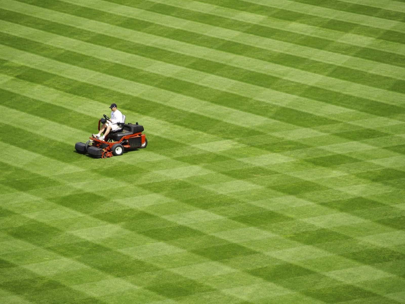 man mowing a cool design into the yard