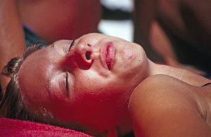 Women laying in the sun getting a tan